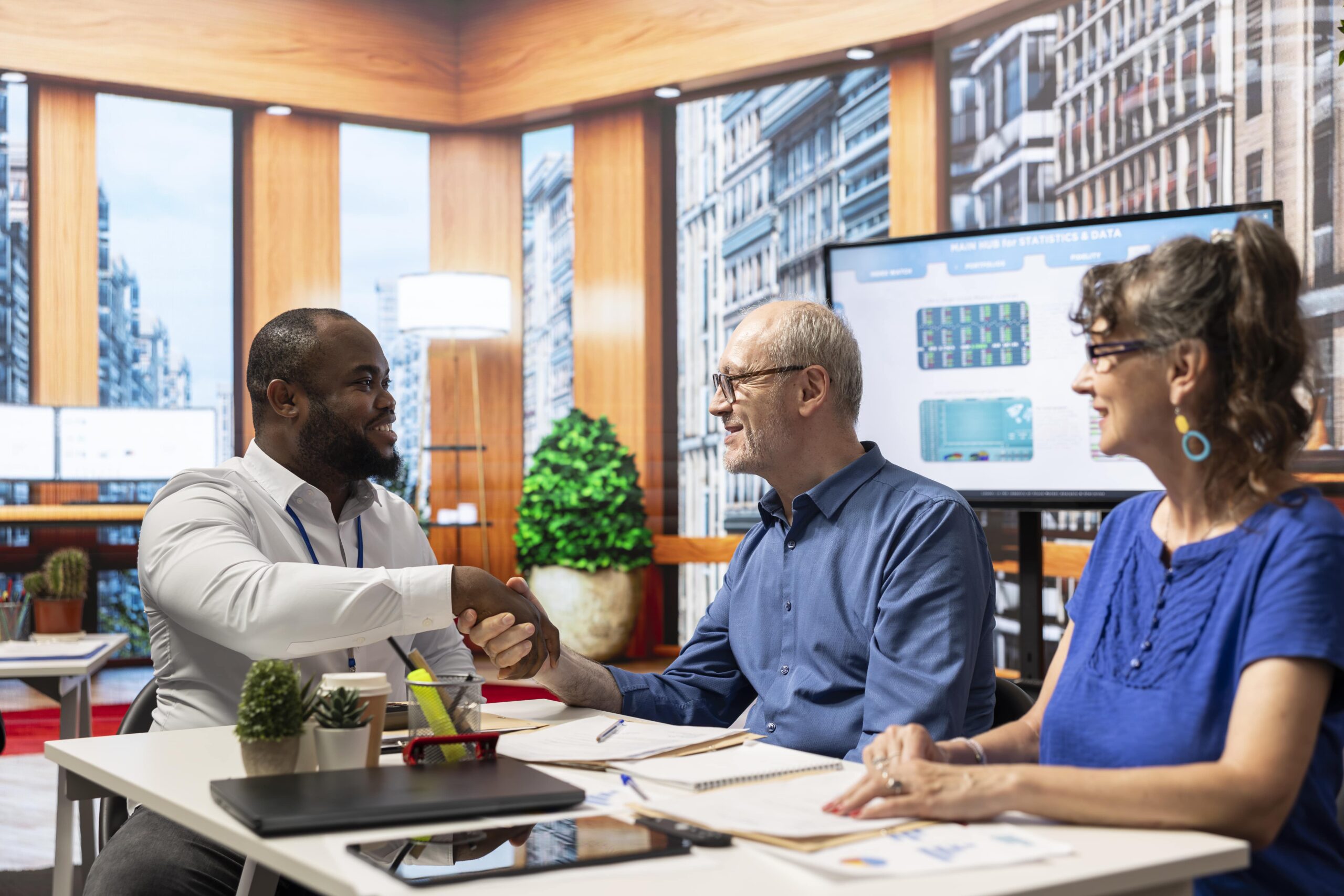 financial-adviser-shaking-hands-in-agreement-with-2025-02-20-02-36-51-utc-min